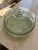Lovely and durable recycled glass cake plate with lid. clear enough to see thru but still a bit camouflaged by the texture...
