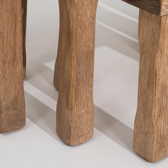 A set of three Brutalist nesting tables constructed from solid oak. The pieces can be arranged together or used...