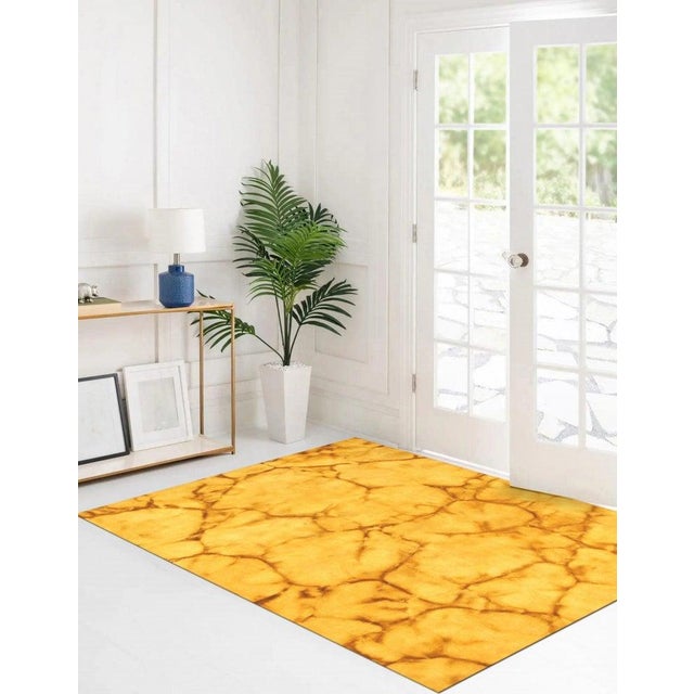 This hand knotted pile runner features a vibrant color palette consisting of yellow, gold, and orange tones. Crafted from...