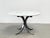 Gorgeous vintage dining table model T69 designed by Osvaldo Borsani made from a brushed metal and black coated base and a...