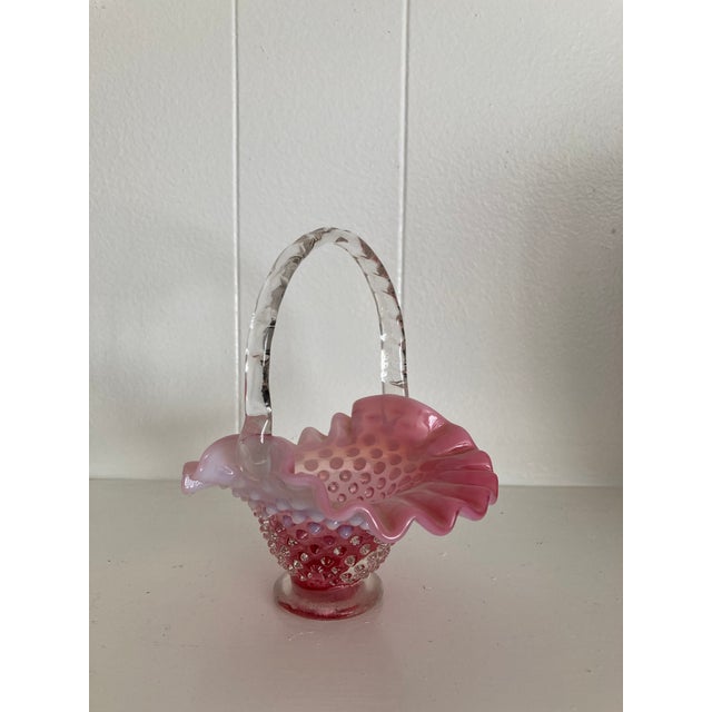 Vintage Fenton Art Glass Cranberry Opalescent Hobnail Basket. Clear, receded glass handle. Delicate. No chips or cracks.