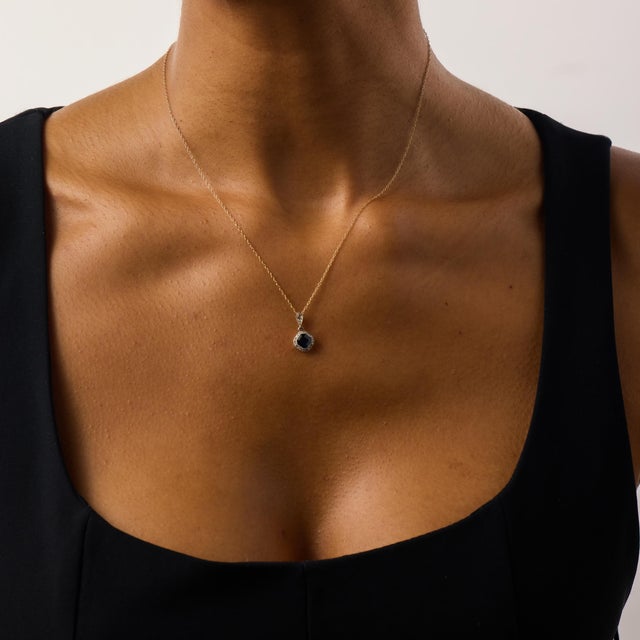 This delicate Edwardian pendant necklace centers on a beautifully proportioned Asscher cut sapphire weighing approximately...