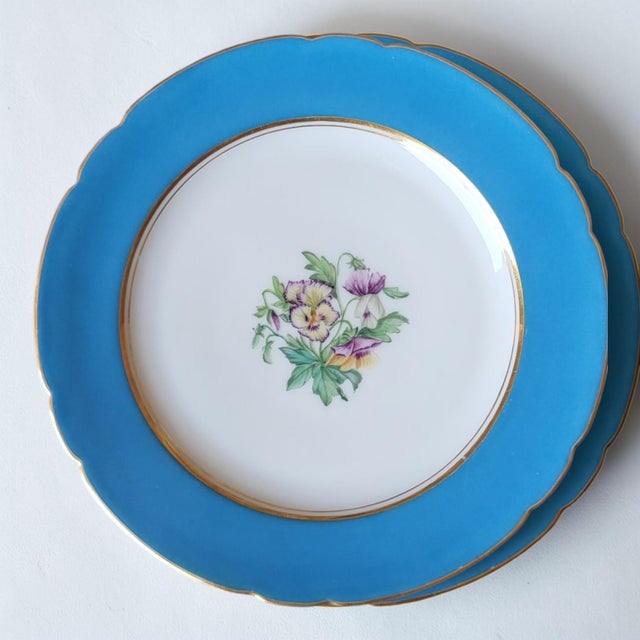 Six 19th-century Vieux Paris porcelain dessert plates / Scalloped edges / Blue rim, central floral design and gilt border...