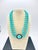 A rare Crown Trifari mid‑century suite featuring its original double‑strand molded turquoise beads with the Crown‑T...
