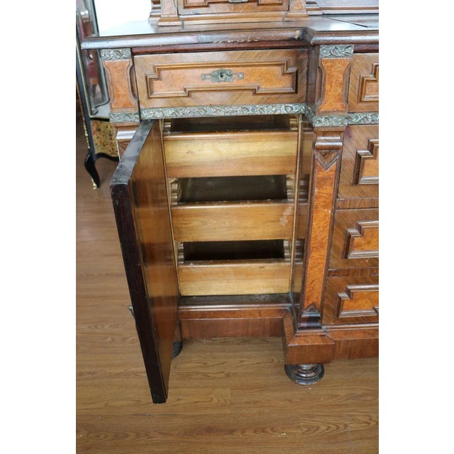 Eclectic sideboard Italy, period end sec. XIX. The cabinet is characterized in the upper part by a beveled mirror in the...