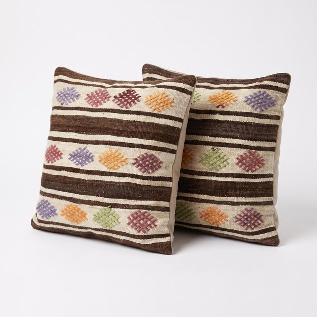 This beautiful 24'' x 24'' pillow cover set was made from authentic Turkish Kilim pieces. Bright colors of wool adorn the...