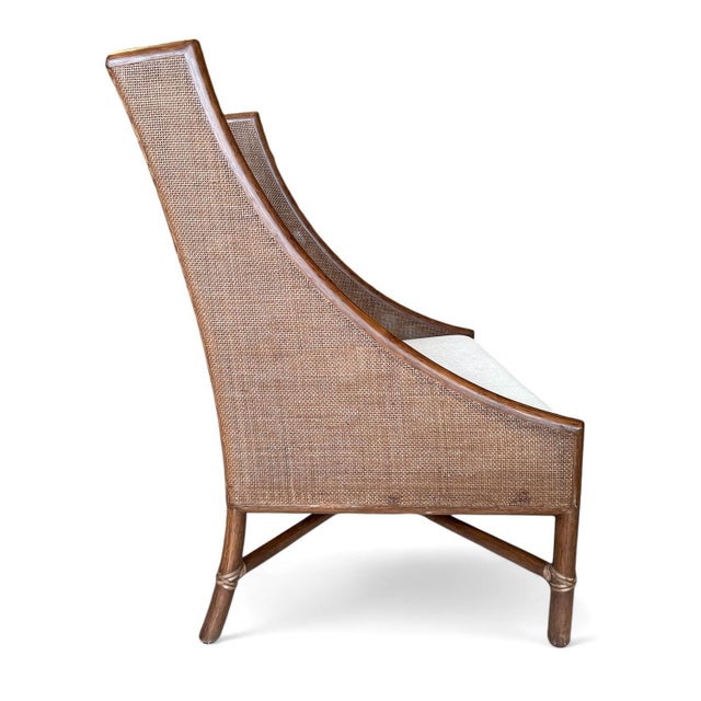 Barbara Barry for McGuire Lounge Chair. The chair has double wall, square-woven can in a rattan frame with rawhide...