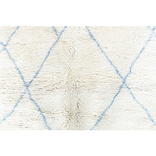 This modern Moroccan rug charms with its soft, cloud-like texture and serene color story. Hand-knotted in luxurious wool,...