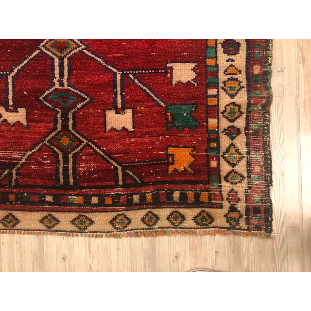 This is a vintage Turkish Oushak rug from the 1960s. The piece was hand-knotted.