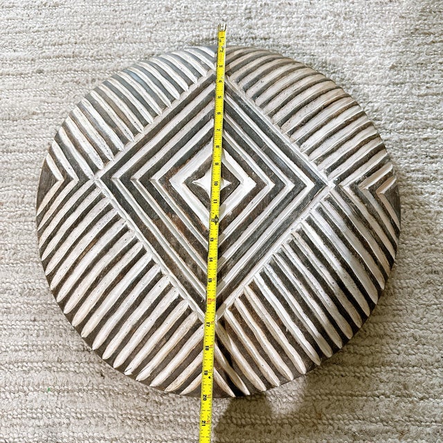 Approx 19.5-20” Bring Cameroon history to your interior décor with this traditional carved shield. This shield is a homage...