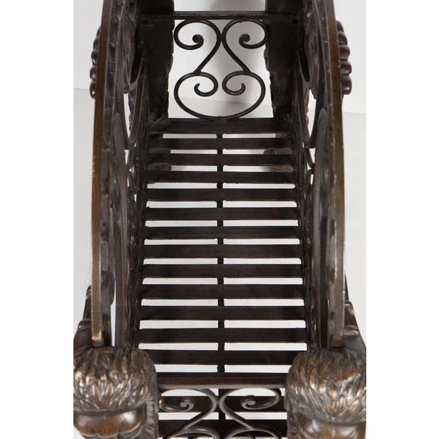 This heavy bronze Regency style magazine Stand features figurative lion supports and scrolled detailing. It is in...