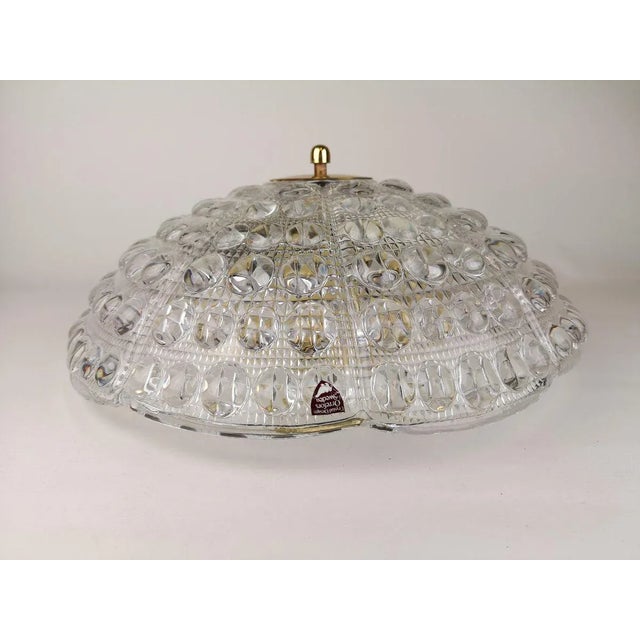 Beautiful ceiling lights designed by Carl Fagerlund for Orrefors, Sweden. The ceiling lamp is made of crystal glass and...
