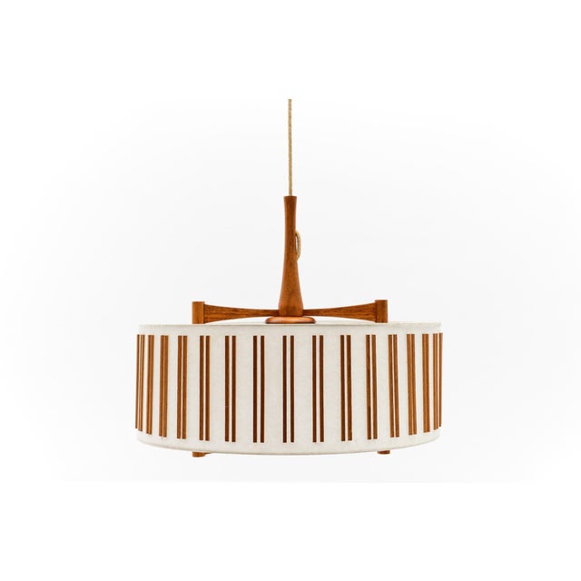 Large shapely teak lamp with jute cord weave. Adjustable from 95cm to 166cm. The lamp is executed with one E27 Edison...