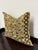 Design Plus Gallery presents a Kuba Cloth Geometric Decorative Pillow. Kuba cloth in olive, black, cream, and ochre forms...