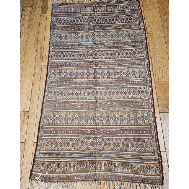 From the steppes of Central Asia comes this remarkable Uzbek soumak kilim, handwoven in the early years of the 20th...
