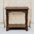 A 19th century rustic oak side table, hand carved with a frieze of acanthus leaves running across the apron beneath a...