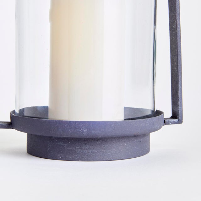 With a finish reminiscent of an aged European zinc, this simple and streamlined outdoor hurricane is made to maintain the...