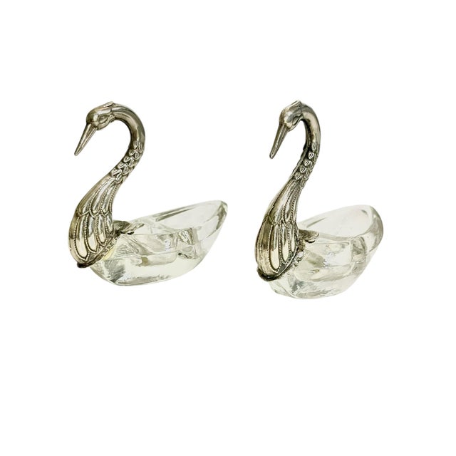 Charming pair of vintage French swan salt cellars dating to the mid-20th century, featuring elegantly curved swan necks...