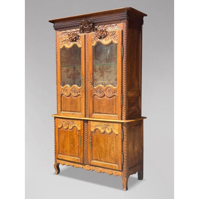 An outstanding example of norman craftsmanship, this impressive french buffet deux corps was crafted in solid oak circa...