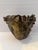 Striking vintage studio pottery vessel featuring sculptural human faces encircling the body with an expressive organic...