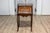 A petite Italian two-toned walnut and mahogany writing desk from the 19th century with slant front, turned three-quarter...