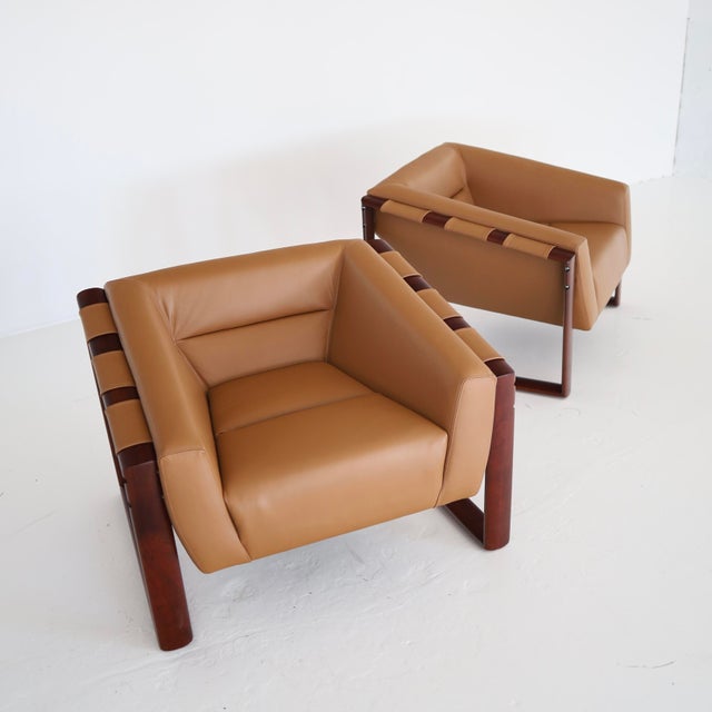 c. 1970s, Brazil in excellent restored condition. Both have been reupholstered in Maharam leather but feature their...