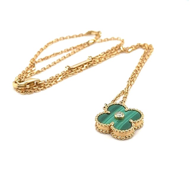 Van Cleef & Arpels Vintage Alhambra Malachite Pendant Necklace: It features the signature four-leaf clover Alhambra motif,...