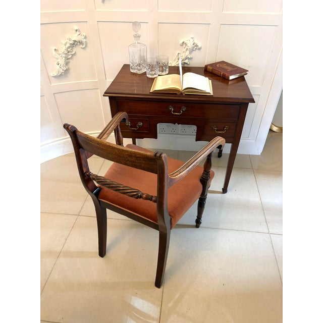 A superb antique Georgian mahogany lowboy of elegant proportions, raised on square tapering legs with refined, understated...