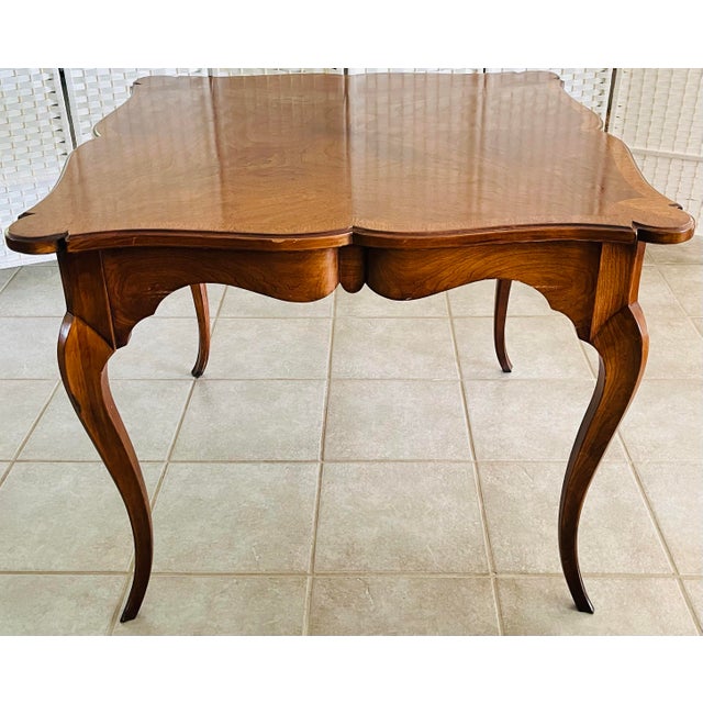 Bring timeless charm to your home with this vintage French Country carved game and dining table, beautifully finished with...