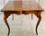 Bring timeless charm to your home with this vintage French Country carved game and dining table, beautifully finished with...