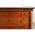 A robust French Empire walnut commode from the 19th century, topped with an incredible slab of Saint Anne marble. The dark...