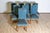 This set of eight 20th-century French mutton-leg side chairs features a classic design inspired by Louis XIII aesthetics....