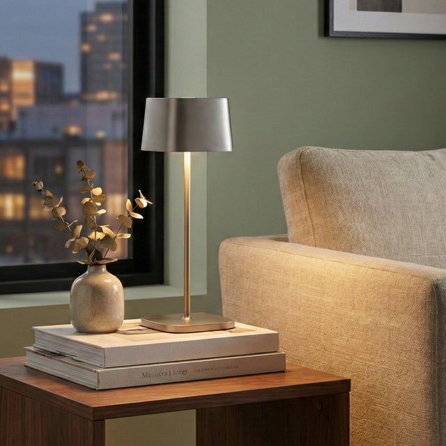 Battery-operated and rechargeable portable table lamp. The lamp features dimming touch control and dimmer memory function,...
