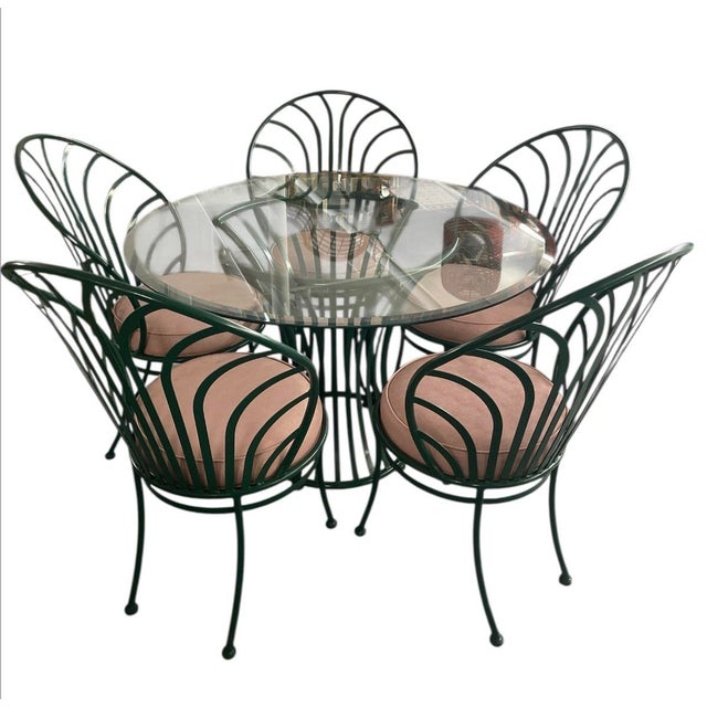 This stunning five-piece patio or indoor dining ensemble features a sophisticated Art Nouveau-inspired aesthetic,...