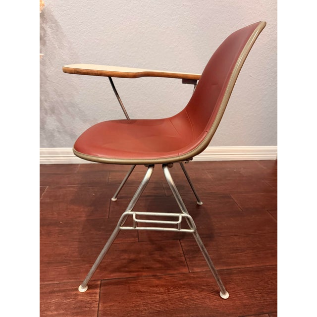 Authentic Charles and Ray Eames fiberglass side shell chair by Herman Miller, with original foam latex upholstery in rust...