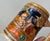 A set of German beer mugs or Bier Steins decorated with jolly medieval pub scenes and sceneri in relief. These were not...