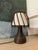 Rich, dark brown bamboo table lamp with an ivory shade. Natural and earthy design, circa 1960. Sourced in Paris....