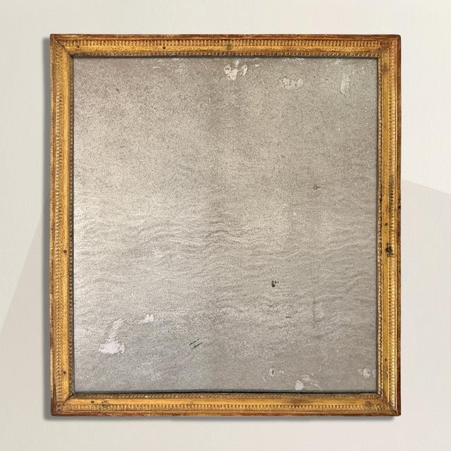 This late 18th–early 19th century French mirror wears its two centuries with a kind of aristocratic nonchalance. The...