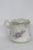 This gorgeous Shaving Mug is made of porcelain. This piece is stamped as being made by Brandenburg. This lovely mug has a...