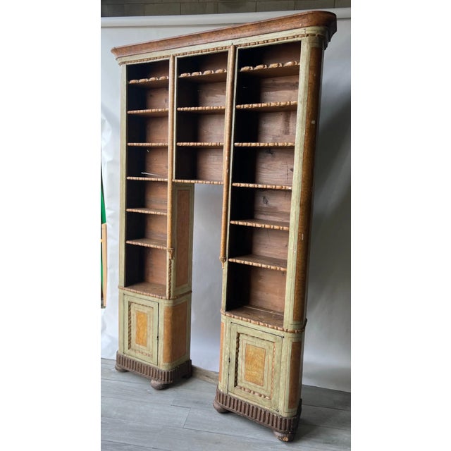 Fabulous and rare from early 18th century paint decorated continental bookcase. One piece built to encompass a pedestal...