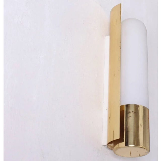 One of three glass and brass wall lights. We have a double version in another listing. 1xL11W/42. To be on the the safe...