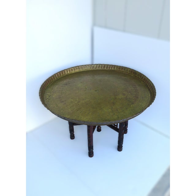A large, round Moroccan brass cocktail/coffee tray table, in the Moorish design style, circa mid-20th century, Morocco....