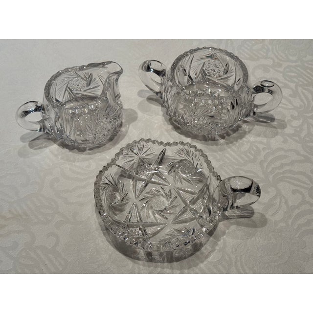 This creamer set is in very good condition. All pieces are extensively had cut from 50% lead crystal. Even the handles are...