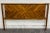 This is a modern king headboard crafted from solid acacia wood with a striking geometric chevron pattern in warm golden...