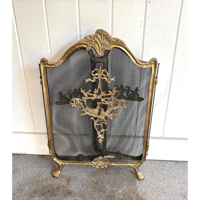 Early 20th-century Victorian style brass floral bouquet folding fireplace screen. Excellent condition. Measures 29" tall...