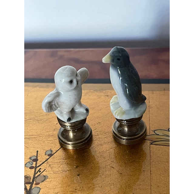 Two cute little critters porcelain figurines mounted on brass bases as lamp finials.
