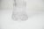 Crystal vase signed Lisa Mori, Austria, in perfect condition with its flared neck and scalloped edges, measuring 24 cm...