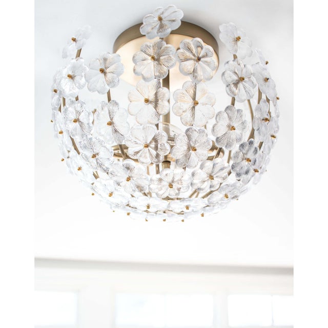 Even more beautiful in person! The detail on the cast glass flowers is breathtaking. Carefully crafted this natural brass...
