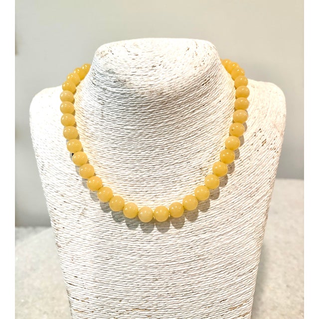 Chic yellow jade beaded necklace with gold tone clasp designed by matthew izzo 8mm beads