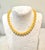 Chic yellow jade beaded necklace with gold tone clasp designed by matthew izzo 8mm beads
